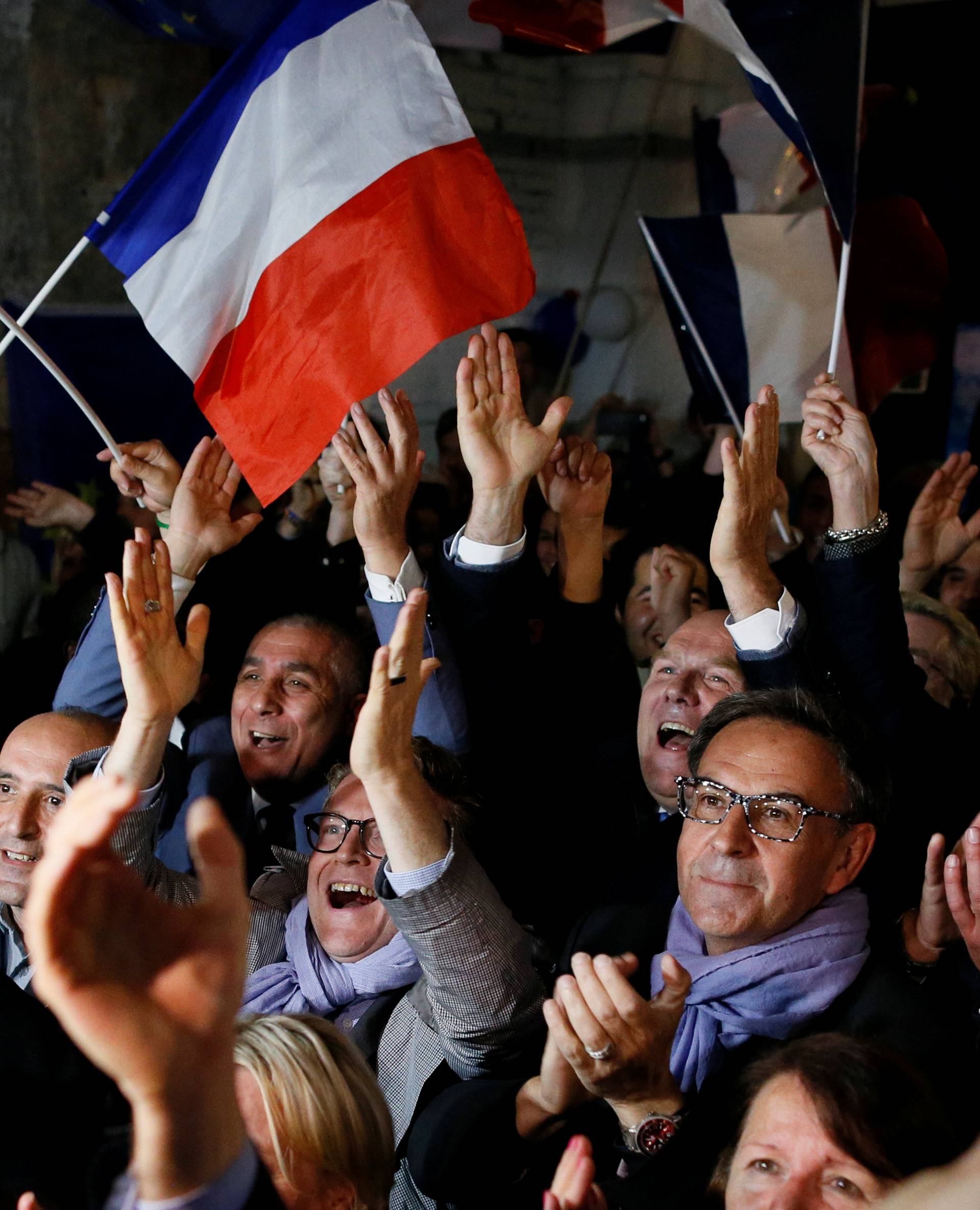 Supporters of Emmanuel Macron celebrate after the second round of 2017 French presidential election, in Lyon