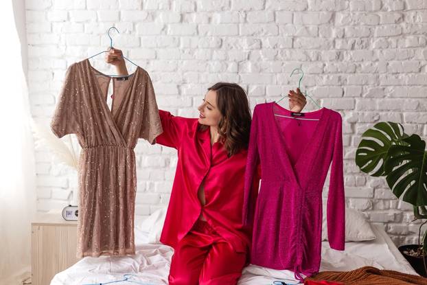 Elegant,Woman,In,Pajamas,Chooses,A,Dress,For,A,Date.