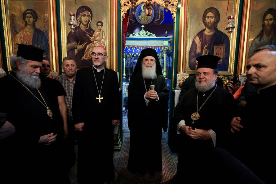 Members of the clergy visit the Greek Orthodox Saint Porphyrius Church, in Gaza City