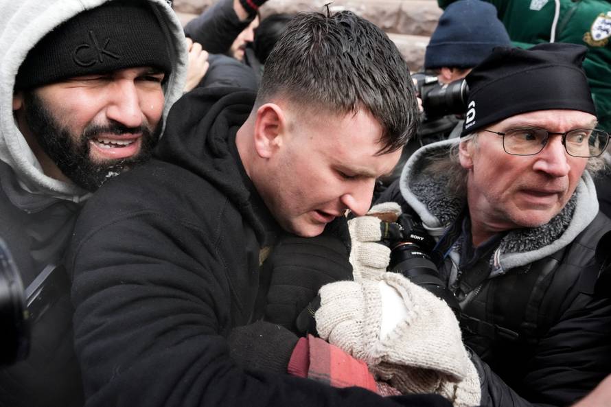 People attend the "March Against Minnesota Fraud" in Minneapolis