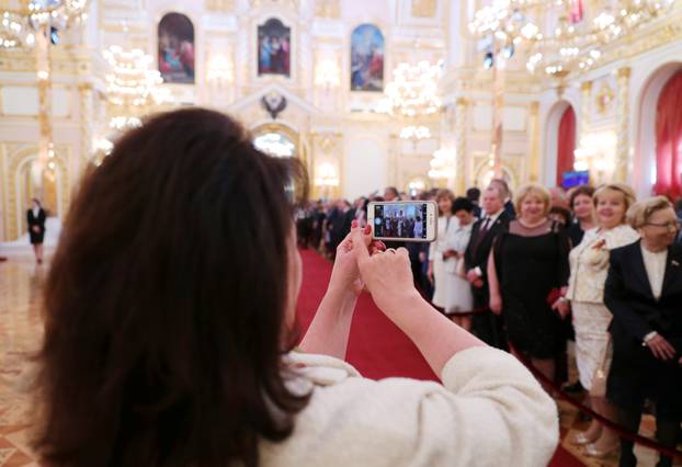 Guests gather before a ceremony to inaugurate Vladimir Putin as President of Russia at the Kremlin in Moscow