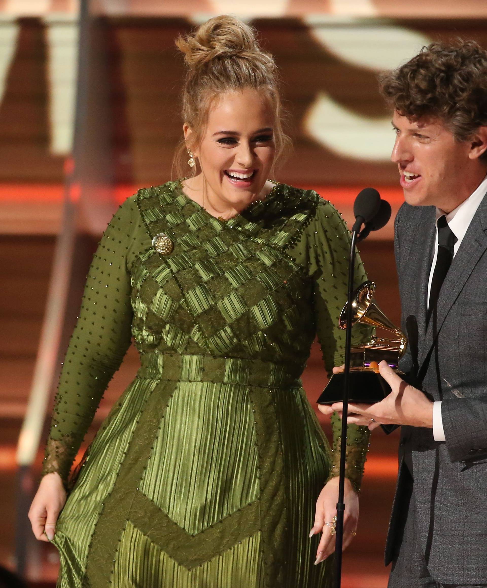 Adele and co writer Kurstin accept the Grammy for Song of the Year for "Hello" at the 59th Annual Grammy Awards in Los Angeles