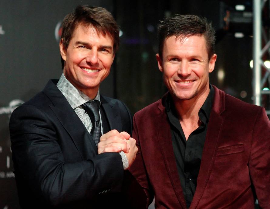 FILE PHOTO: U.S. actor Tom Cruise poses with Austrian skydiver Felix Baumgartner on the red carpet for the German language premiere of Cruise's film "Oblivion" in Vienna