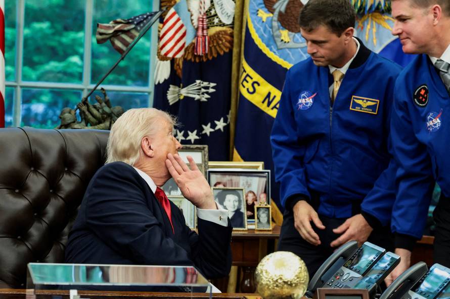 U.S. President Donald Trump meets Artemis II astronauts in the Oval Office at the White House in Washington