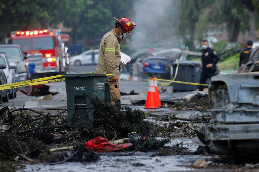 Crash scene after a civilian aircraft went down in a military neighborhood, in San Diego