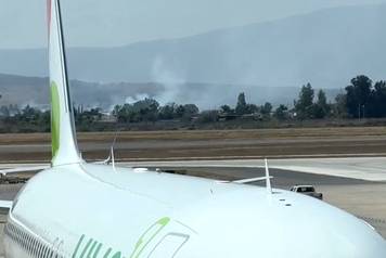 A view from the Guadalajara International Airport shows smoke billowing amid a wave of violence, in Tlajomulco de Zuniga