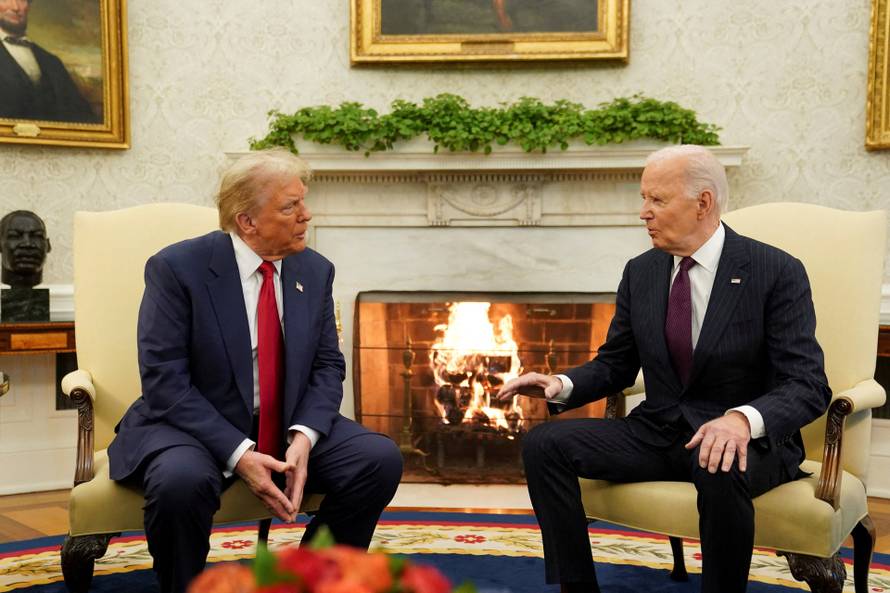 FILE PHOTO: U.S. President Joe Biden meets with President-elect Donald Trump in the Oval Office at the White House in Washington