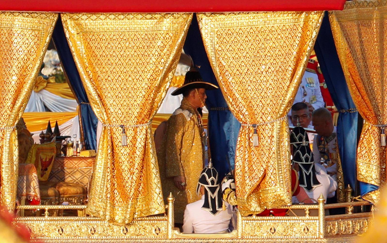 Thailand's King Maha Vajiralongkorn takes part in a royal barge river procession along the Chao Praya river in Bangkok