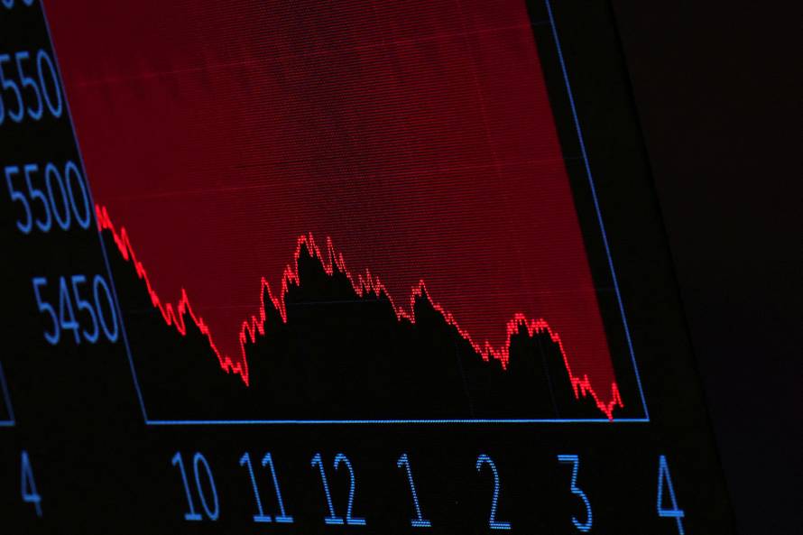 Traders work on the floor of the NYSE in New York