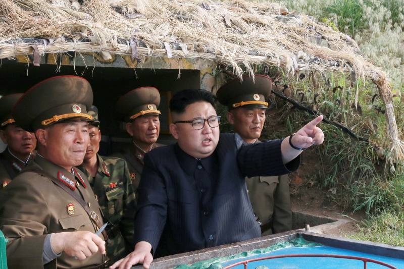 North Korean leader Kim Jong Un inspects the defence detachment on Jangjae Islet and the Hero Defence Detachment on Mu Islet located in the southernmost part of the waters off the southwest front, in this undated photo released by North Korea's KCNA