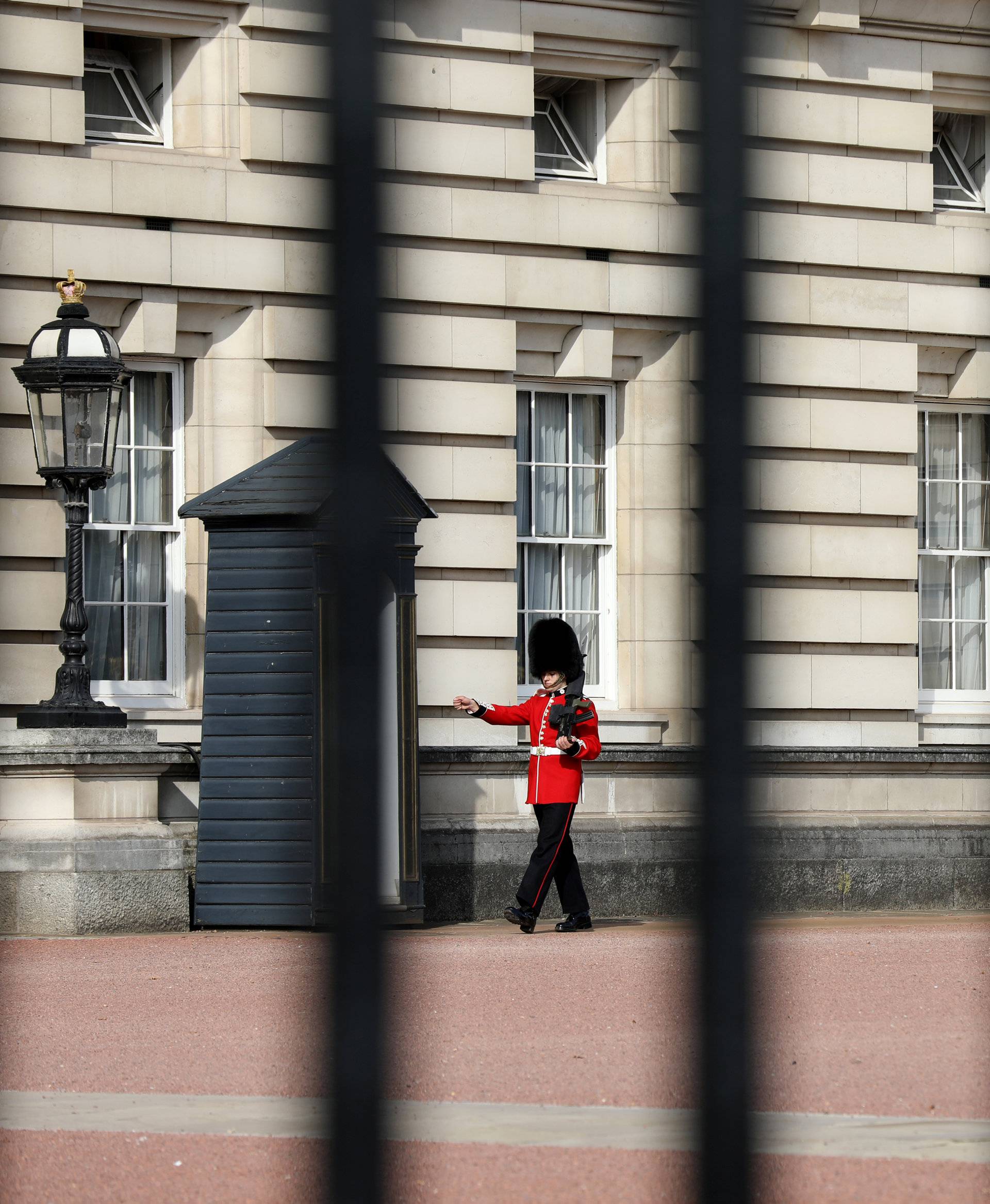 A guardsman is seen on duty in the grounds of Buckingham Palace in London