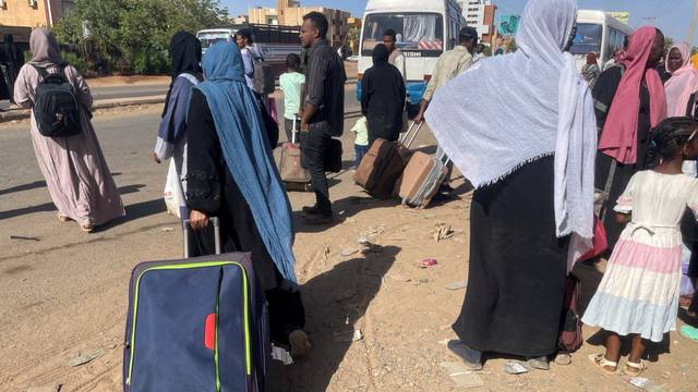 People gather at the station to flee from Khartoum