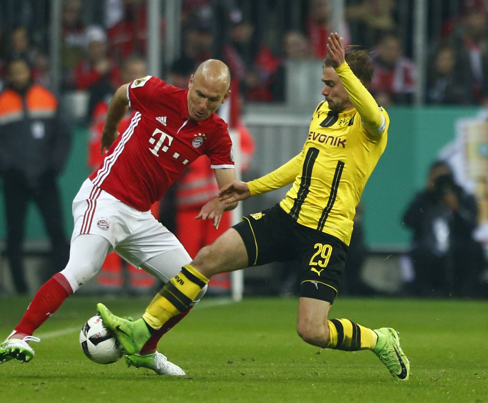 Bayern Munich's Arjen Robben in action with Borussia Dortmund's Marcel Schmelzer