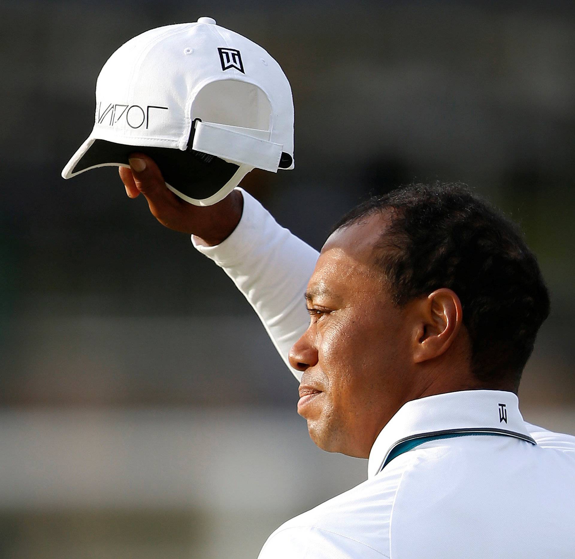 FILE PHOTO: Woods of the U.S. acknowledges the crowd as he walks off the 18th green during the second round of the British Open golf championship on the Old Course in St. Andrews, Scotland