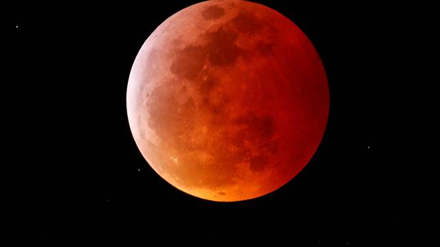 A total lunar eclipse that is called a 'Super Blood Wolf Moon' is seen from Encinitas, California