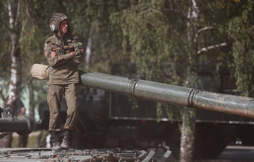 A Russian servicemen stands on an armoured vehicle during the annual international military-technical forum "ARMY" in Alabino