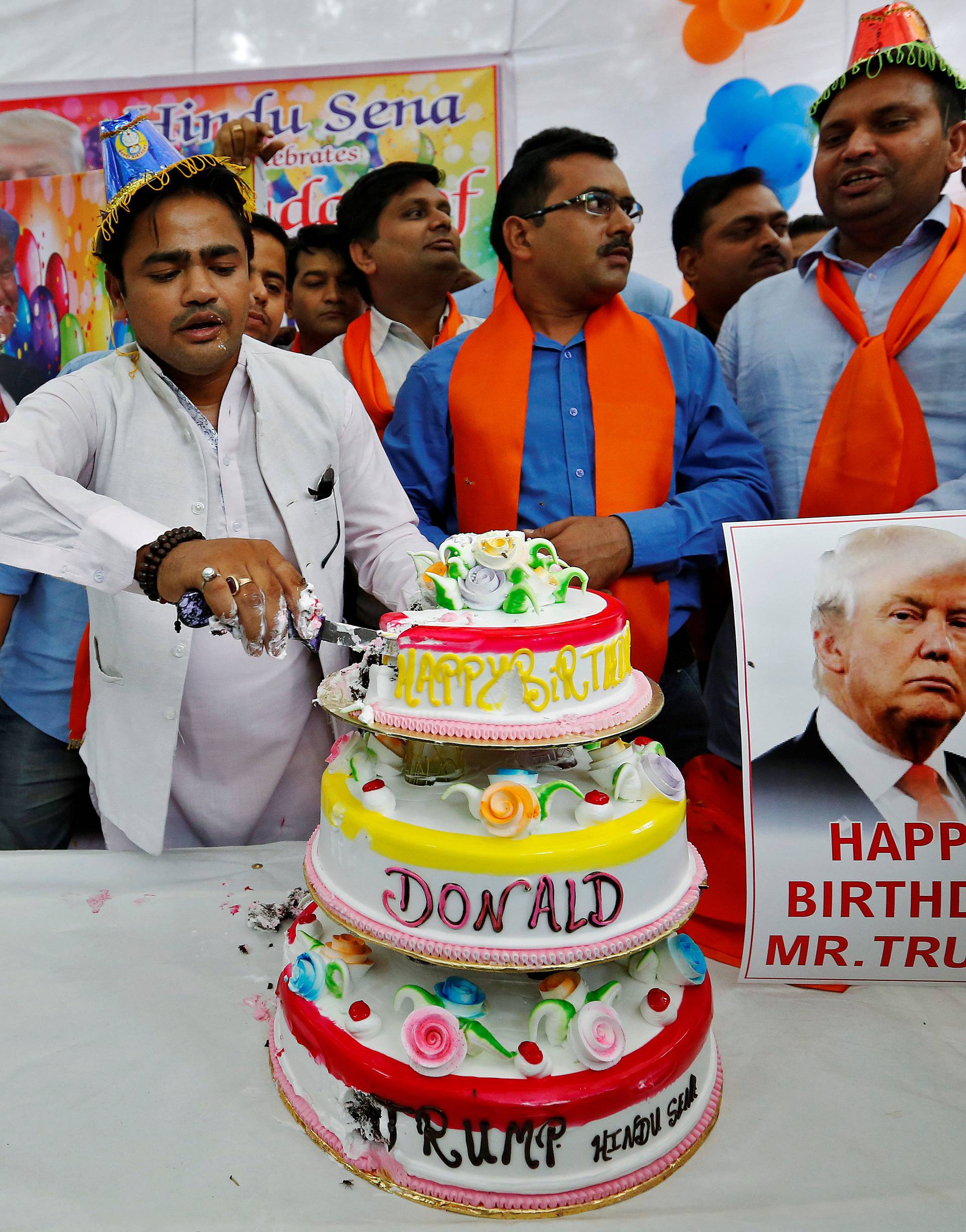 Members of Hindu Sena, a right wing Hindu group, celebrate U.S. Republican presidential candidate Trump's birthday in New Delhi