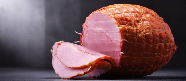Composition with piece of ham. Meatworks products