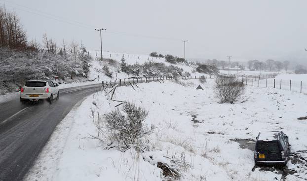 A vehicle is seen in a field after it left the road, next to A924 near Kinnaird