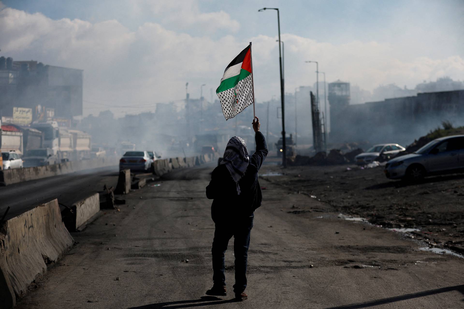 FILE PHOTO: Palestinians clash with Israeli forces near Qalandia