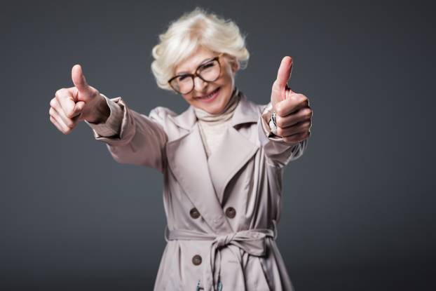 senior woman with thumbs up