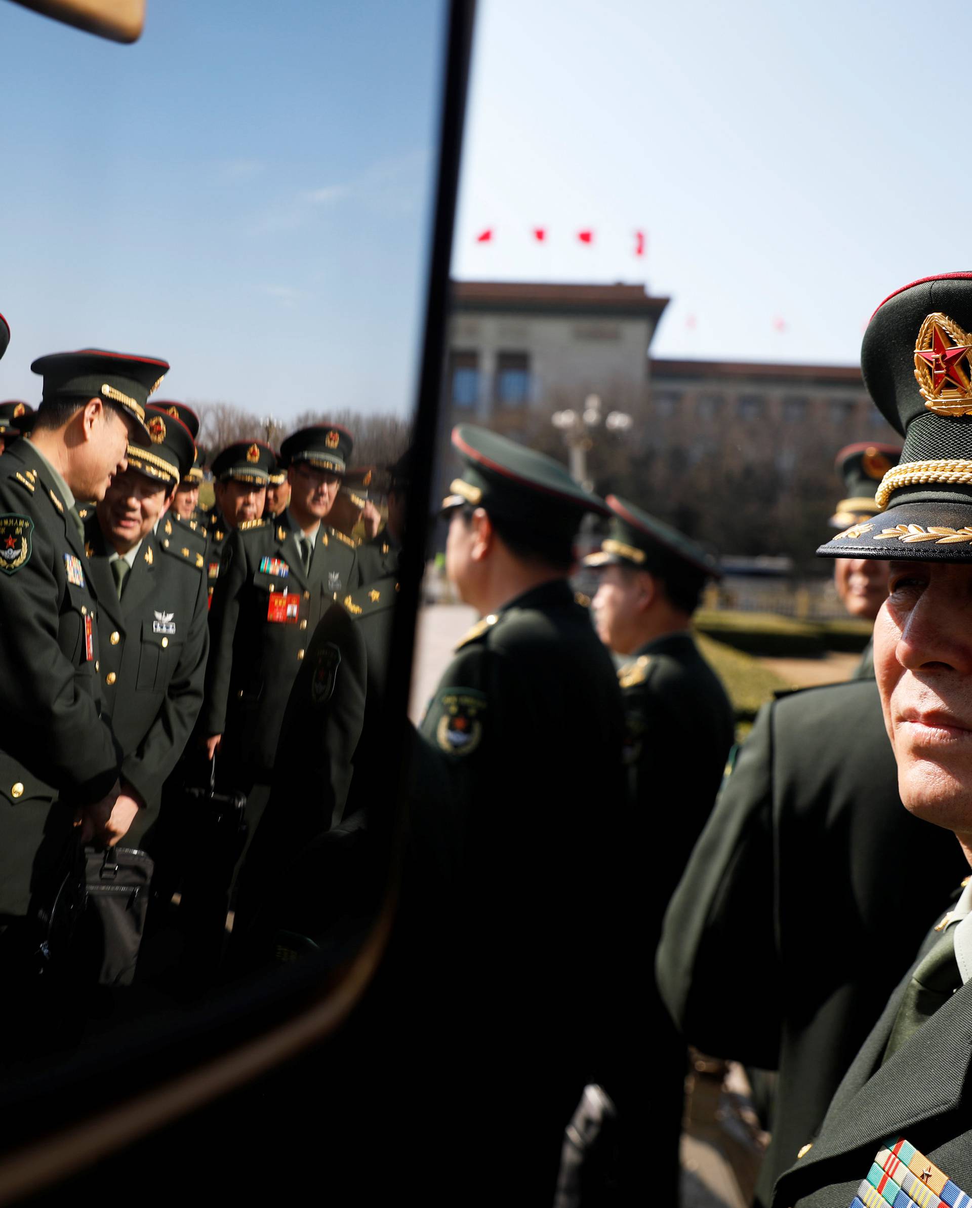 Military delegates arrive for the second plenary session of the National People's Congress (NPC) in Beijing