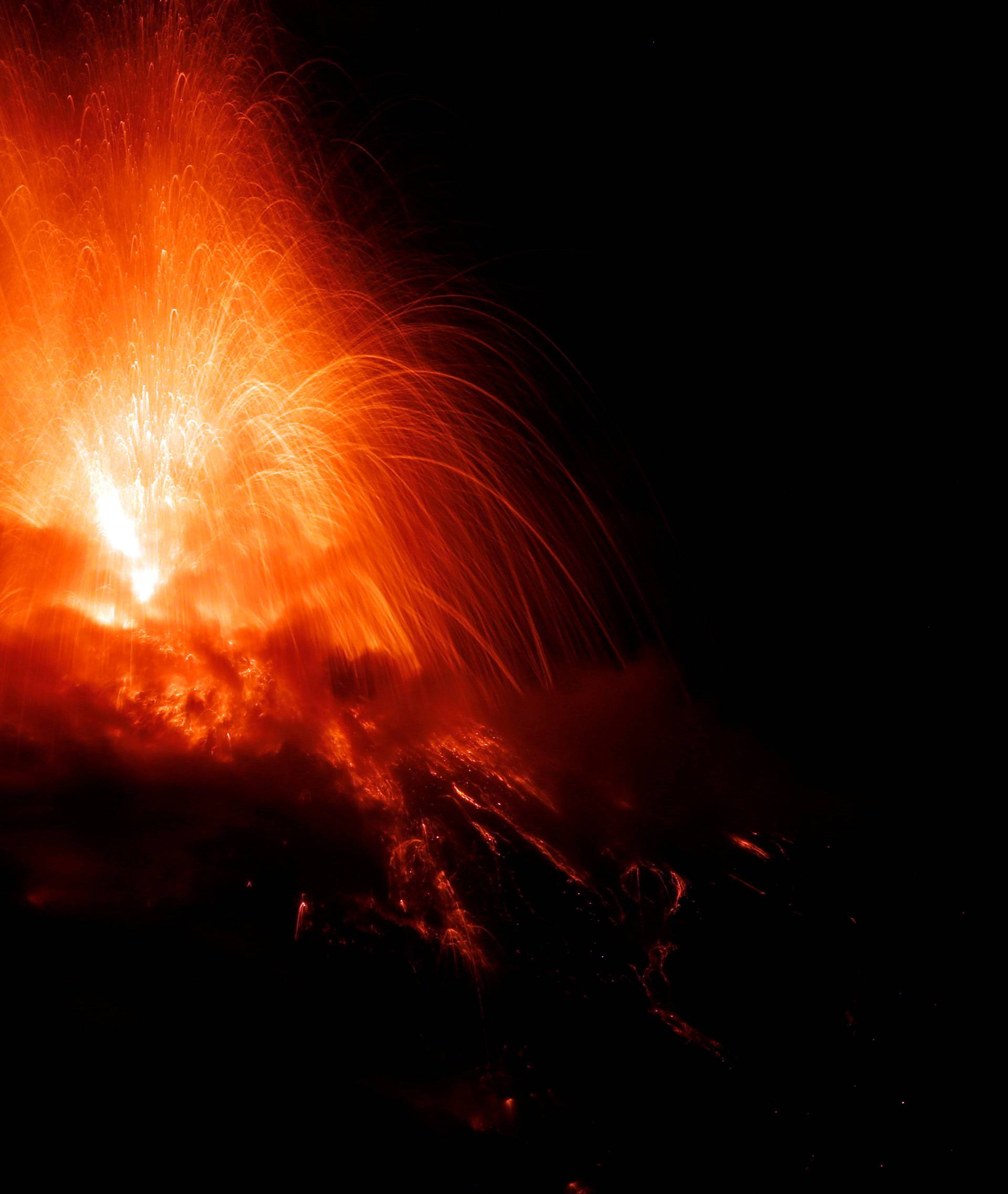 A general view shows Fuego volcano (Volcano of Fire) erupting as seen from San Juan Alotenango