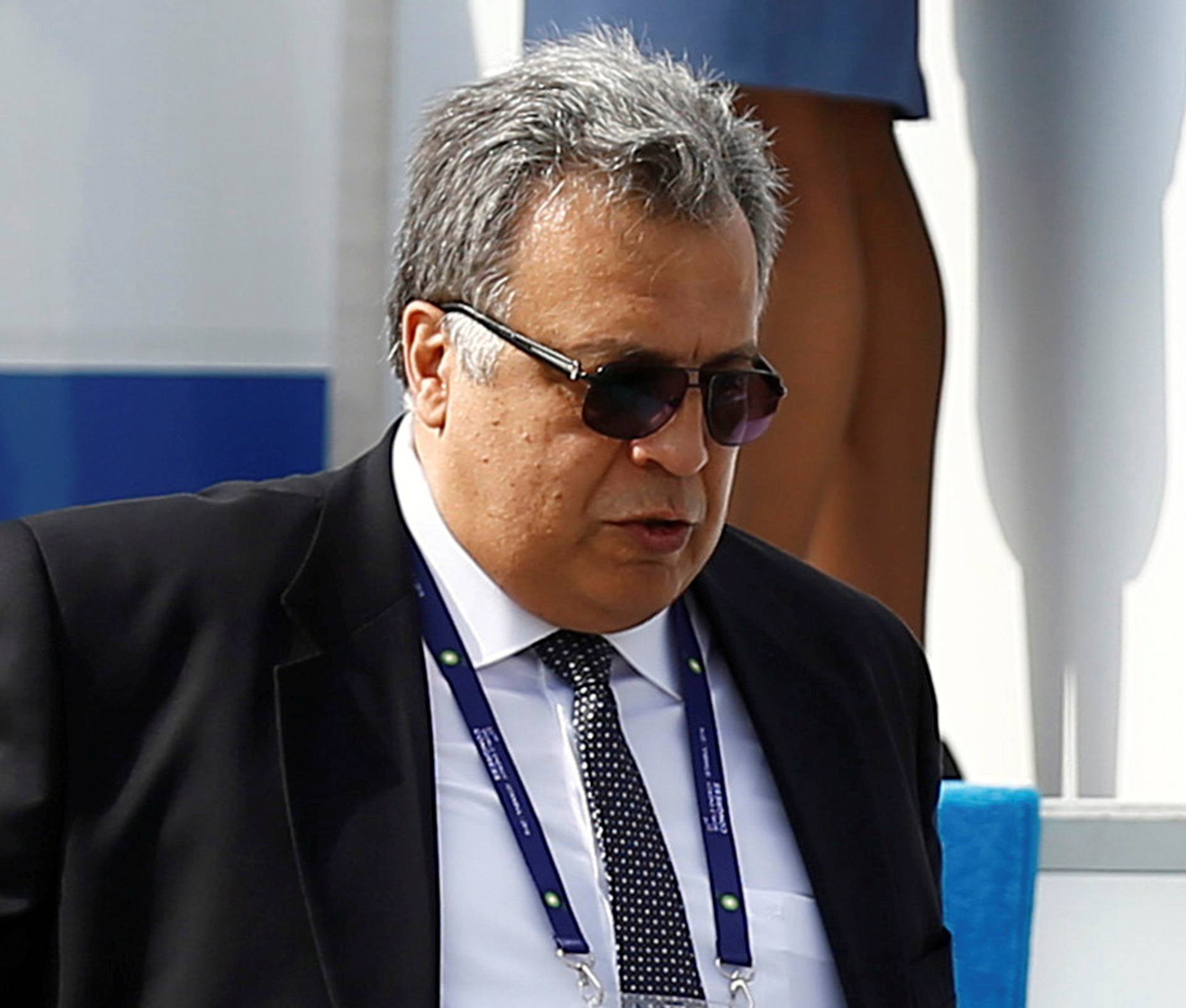 FILE PHOTO: Russian Ambassador to Turkey Andrei Karlov accompanies Russian President Vladimir Putin who disembarks from the Presidential aircraft at Ataturk airport in Istanbul