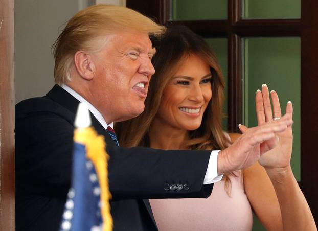 President Trump and Melania Trump bid farewell to Kenya President Kenyatta at the White House in Washington