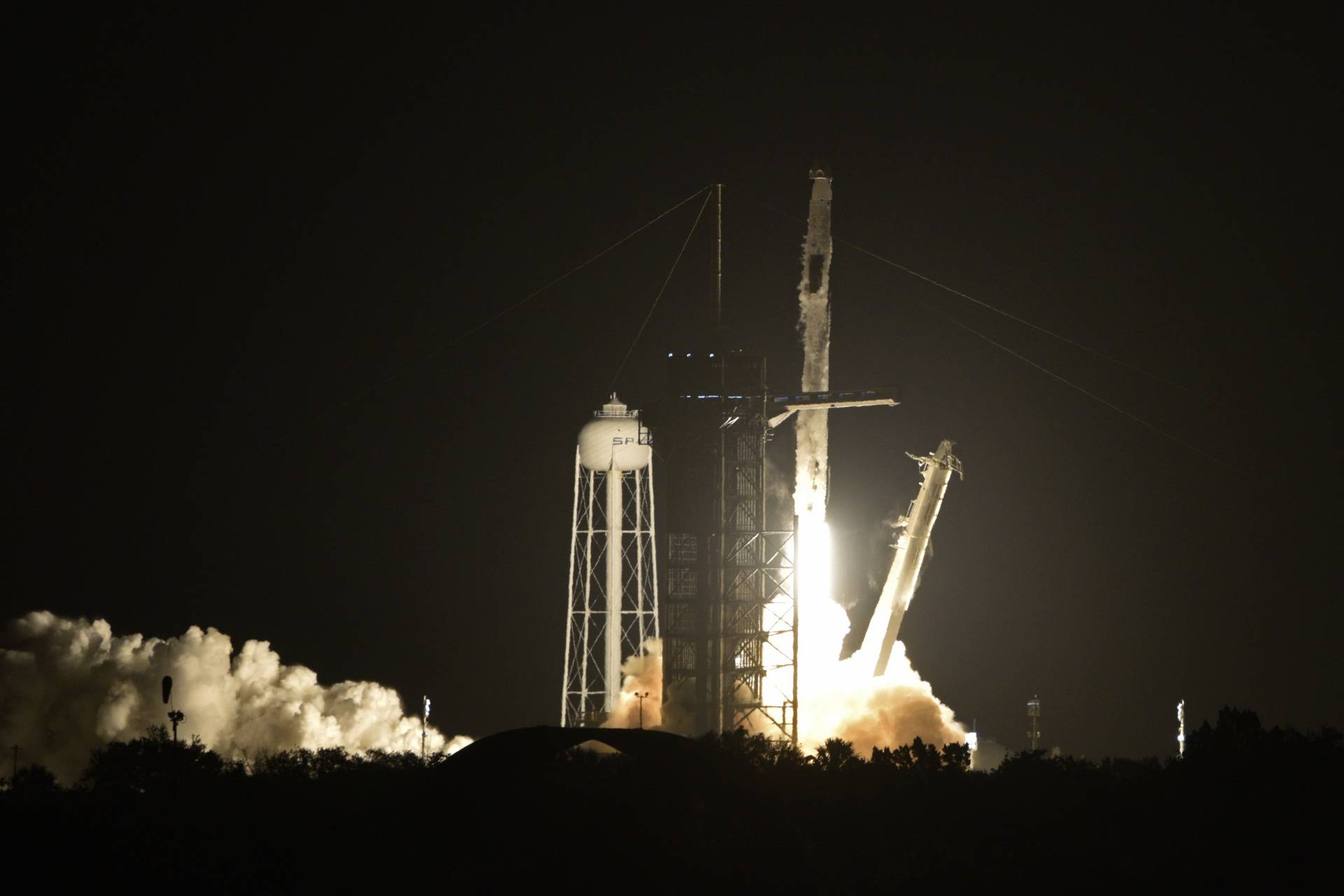 A SpaceX Falcon 9 rocket, with the Crew Dragon capsule, carrying four astronauts on a NASA commercial crew mission, launches at the Kennedy Space Center