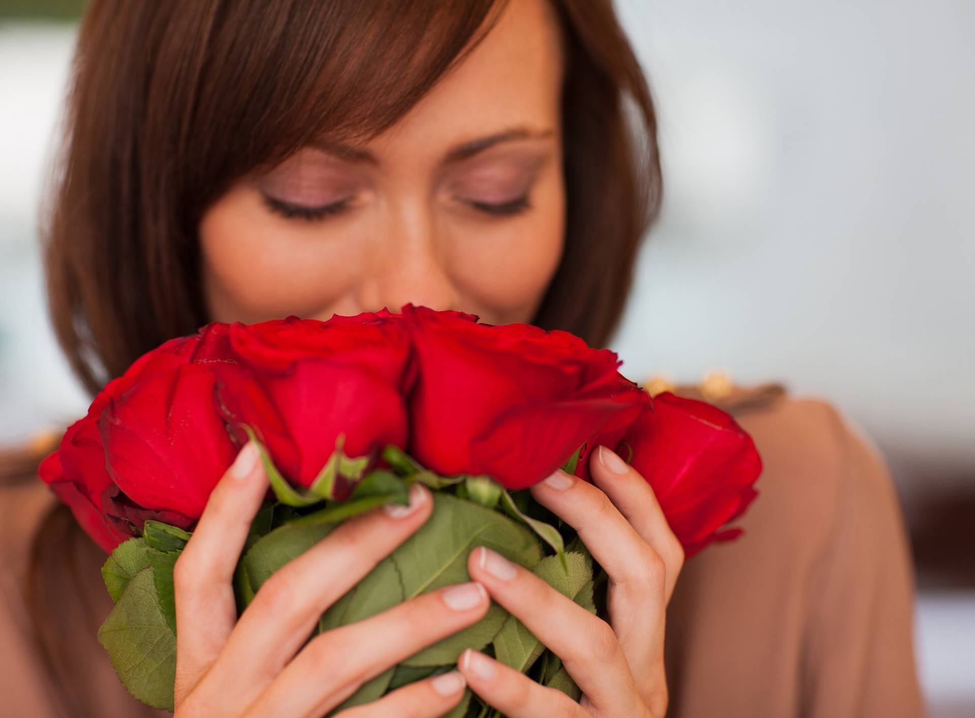 Woman smelling roses