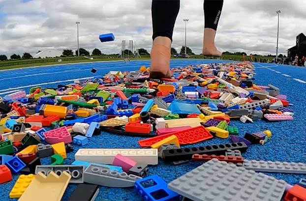 VIDEO: Woman breaks bizarre world record for fastest 100m run barefoot over LEGO