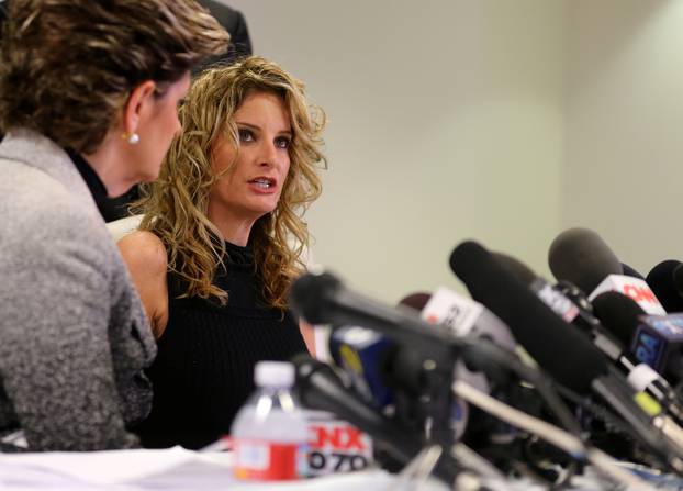 Summer Zervos speaks as her attorney Gloria Allred looks on during a news conference announcing the filing of a lawsuit against President-elect Donald Trump in Los Angeles
