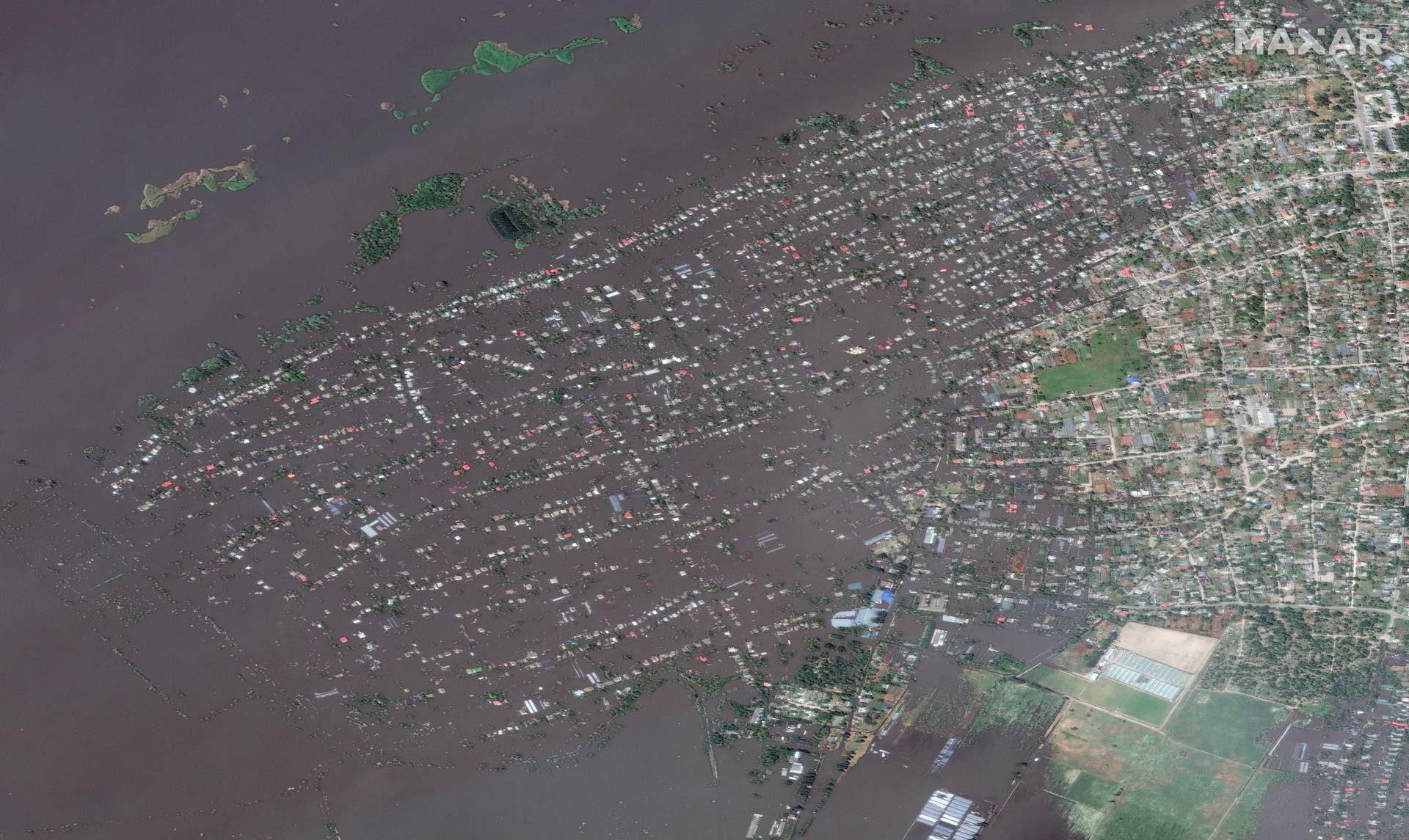 A satellite image shows the flooded town of Oleshky