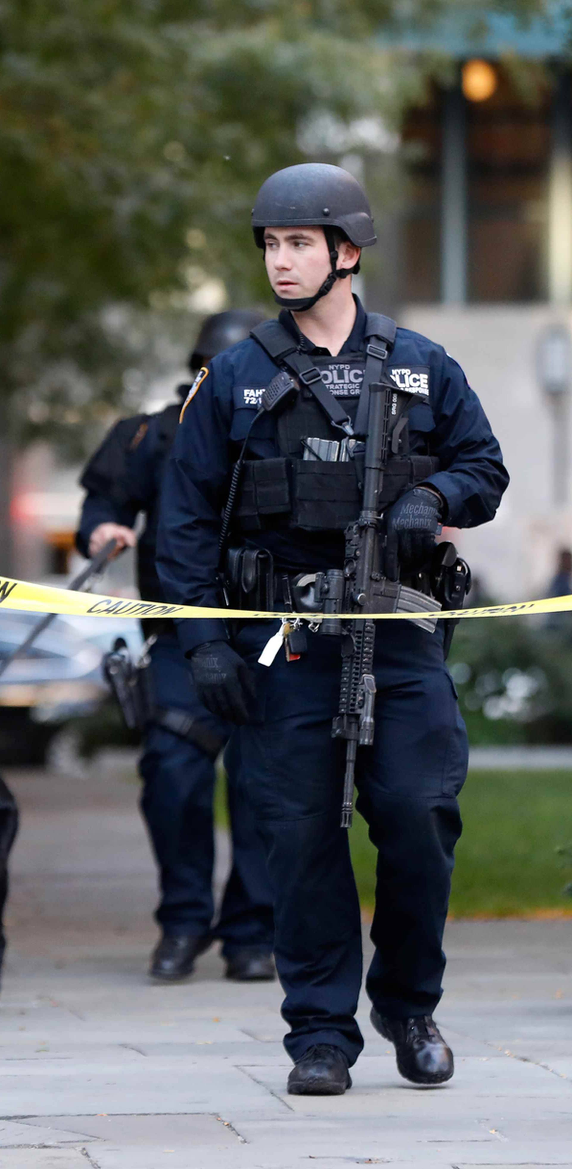 Parents pick up their children from P.S./I.S.-89 school after a shooting incident in New York City