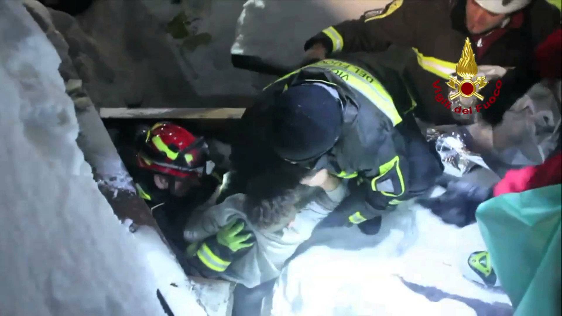 A still image taken from a video shows a survivor, rescued by Italian Firefighters, at the Hotel Rigopiano in Farindola, central Italy, which was hit by an avalanche