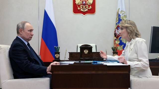 Russian Presidential Commissioner for Children's Rights Maria Lvova-Belova meets with Russian President Vladimir Putin outside Moscow