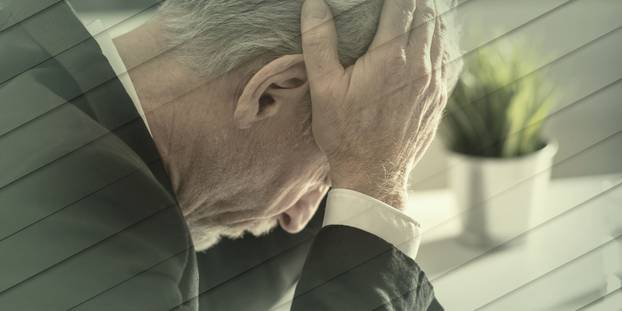 Overworked businessman holding his head between his hands, geome