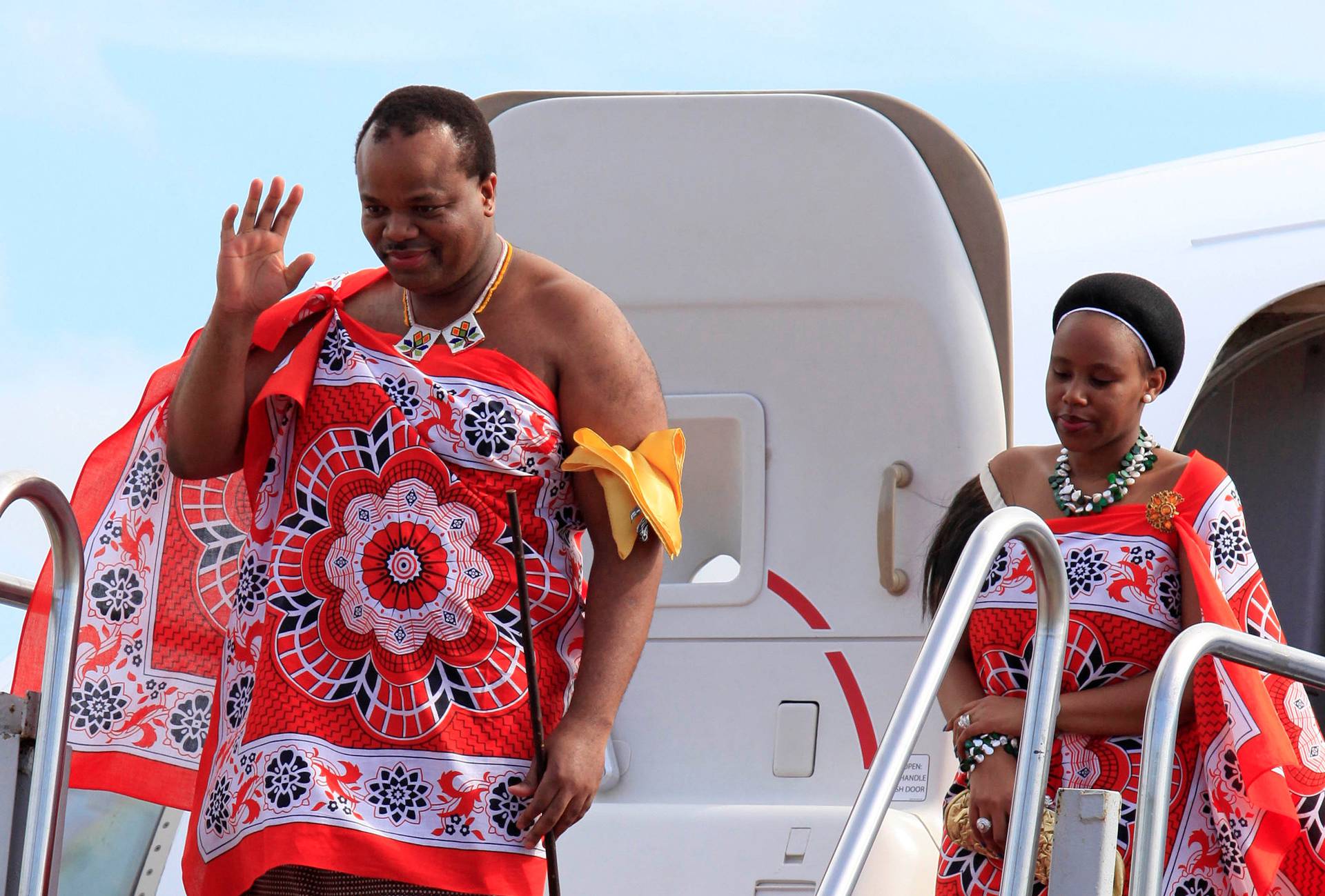 FILE PHOTO: King of Swaziland Mswati iii and his wife disembark a plane after arriving at Katunayake International airport in Colombo