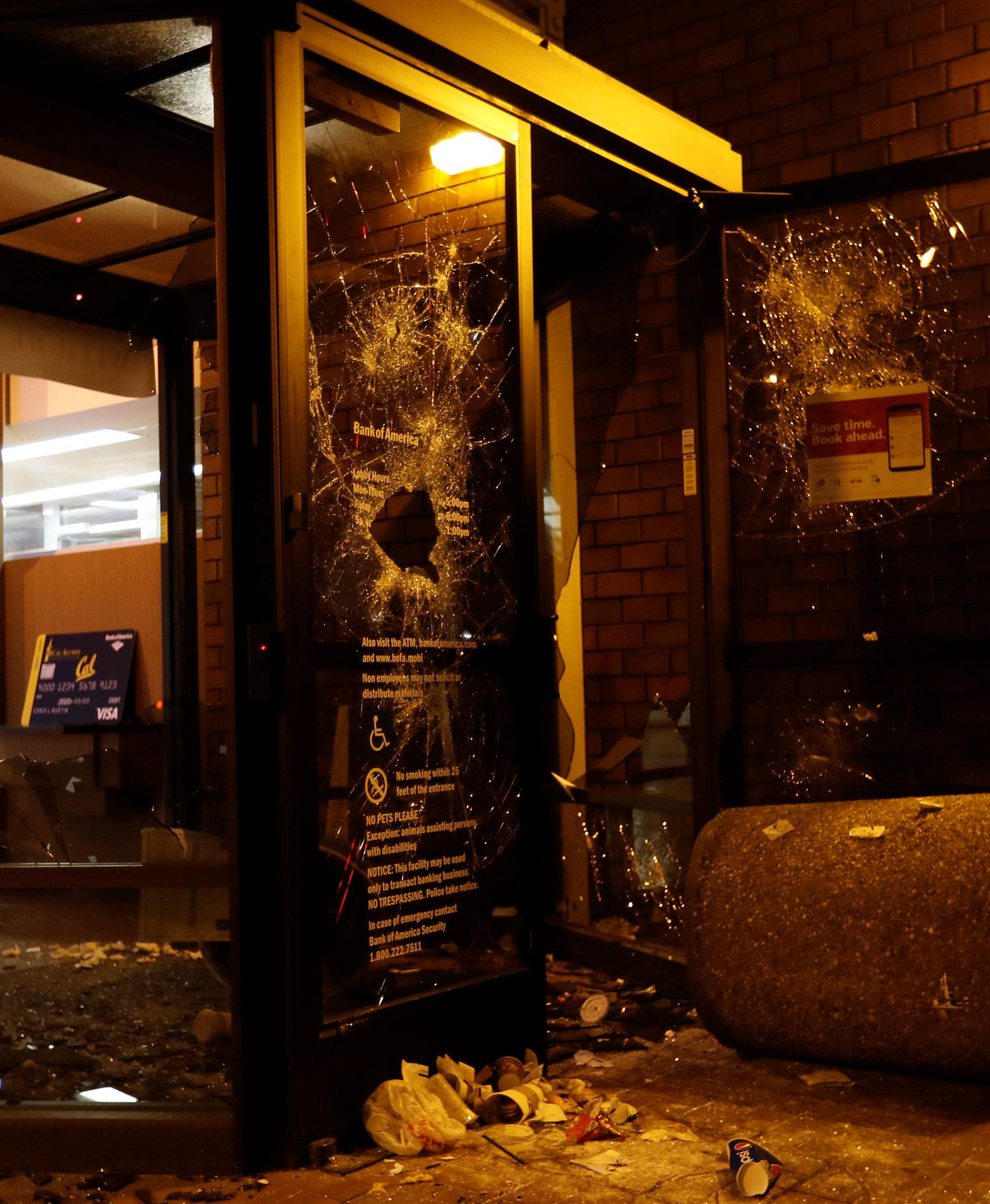 A vandalized Bank of America office is seen after a student protest turned violent at UC Berkeley during a demonstration over right-wing speaker Milo Yiannopoulos, who was forced to cancel his talk, in Berkeley, California