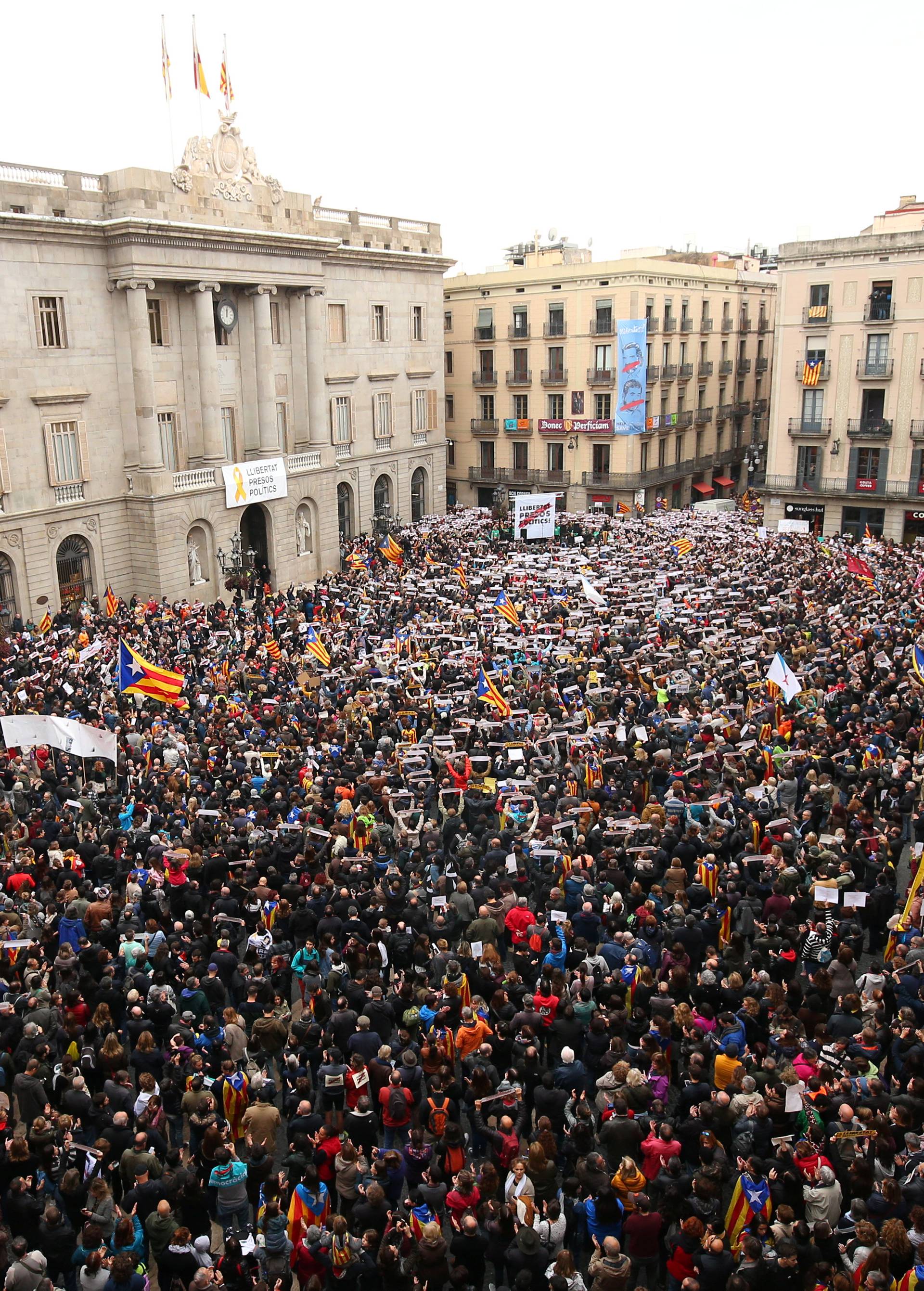 Protesters gather in Sant Jaume square at a demonstration during a partial regional strike in Barcelona