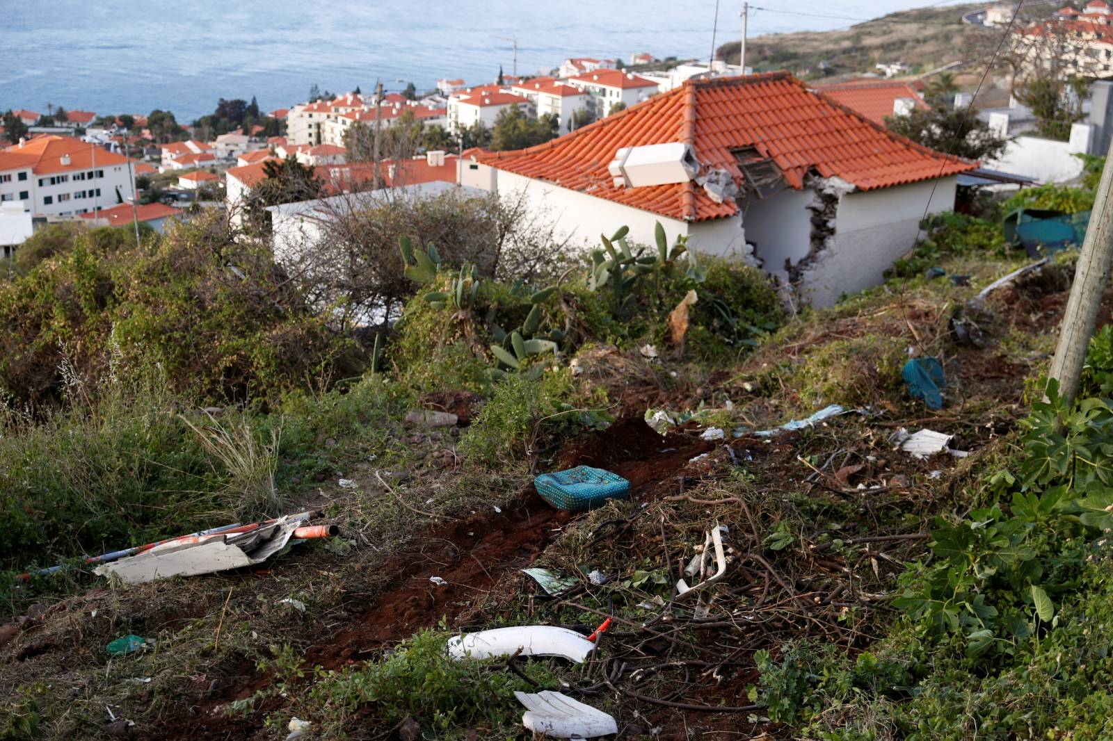 The site of a bus accident is seen in Canico