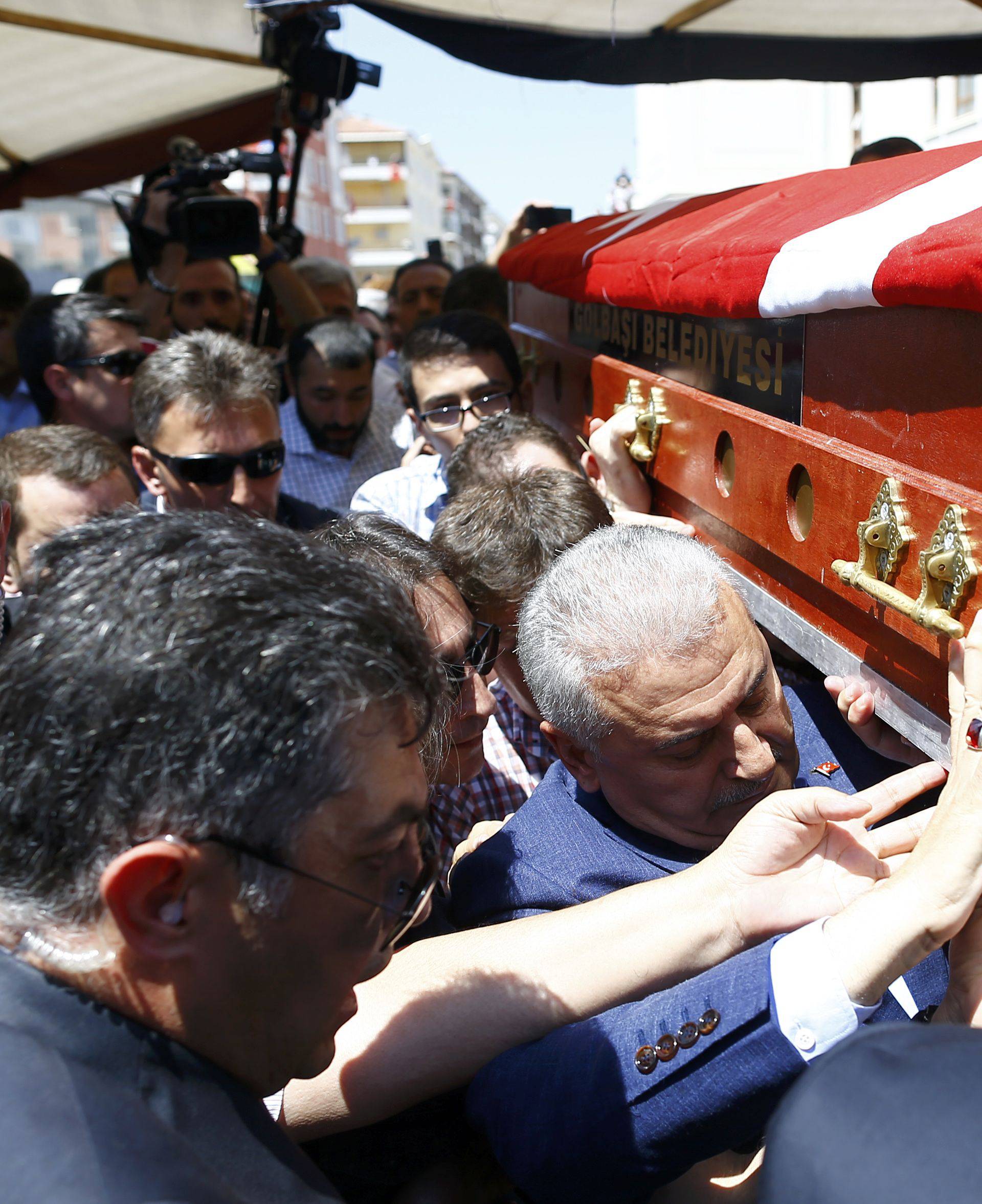 A coffin with a victim of the thwarted coup is carried to a funeral service in Ankara