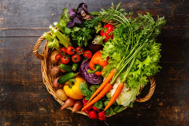 Fresh,Vegetables,In,Basket,On,Wooden,Background