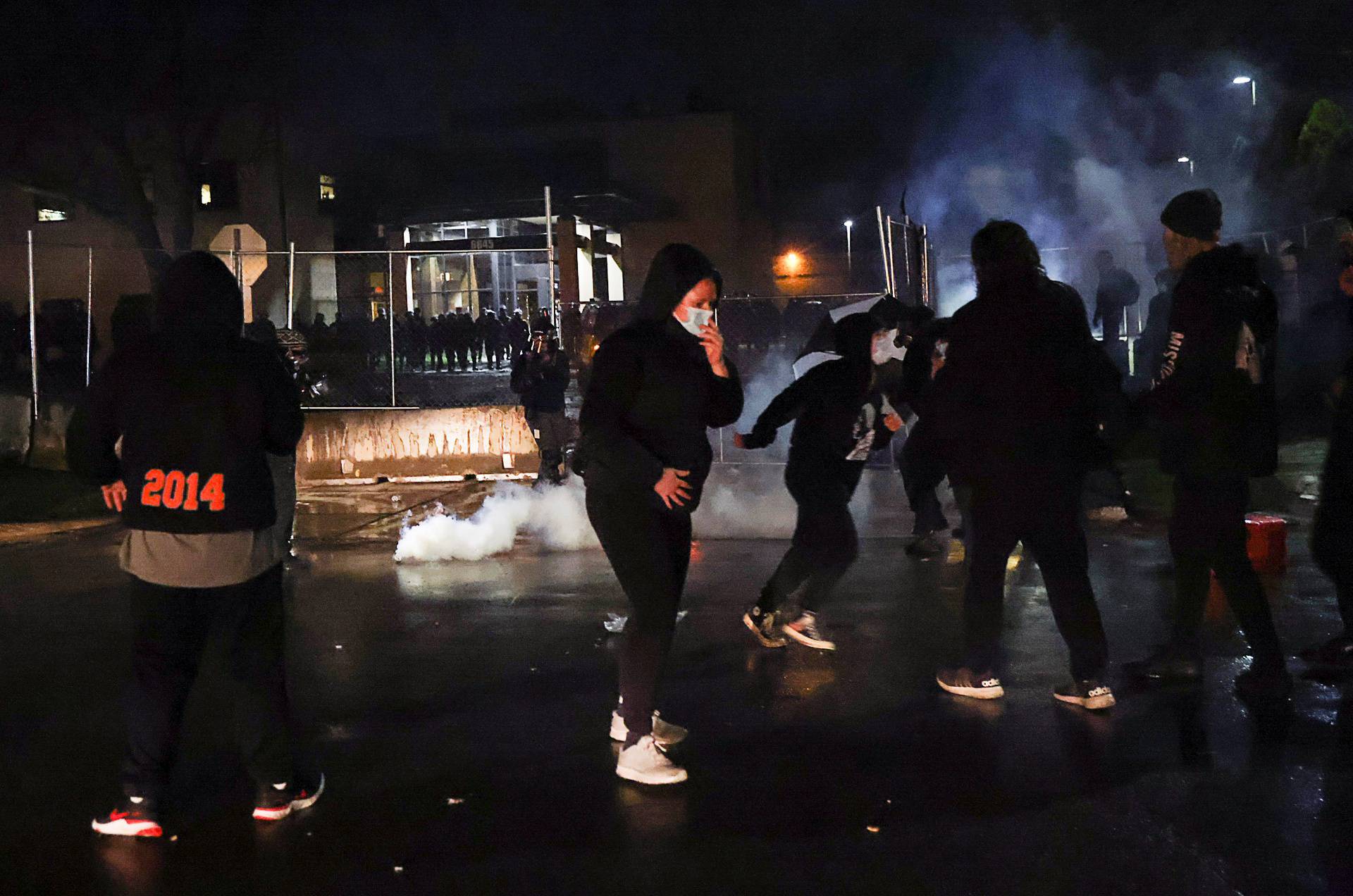 Protesters rally outside Brooklyn Center Police Department a day after Daunte Wright was shot and killed by a police officer, in Brooklyn Center, Minnesota