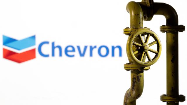 FILE PHOTO: Illustration shows Chevron logo and natural gas pipeline