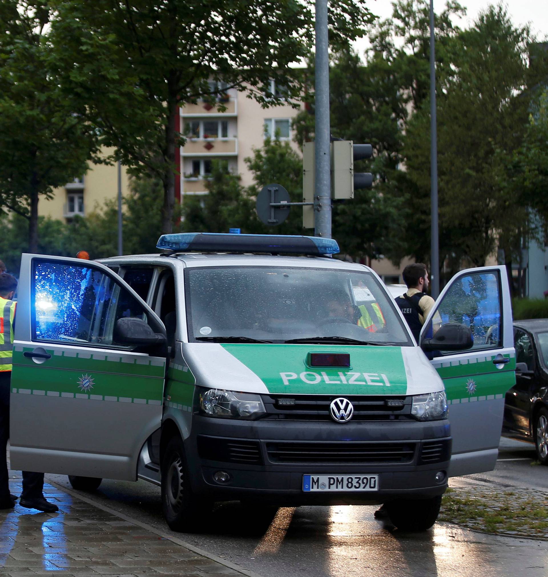 Police secure a street near to the scene of a shooting in Munich