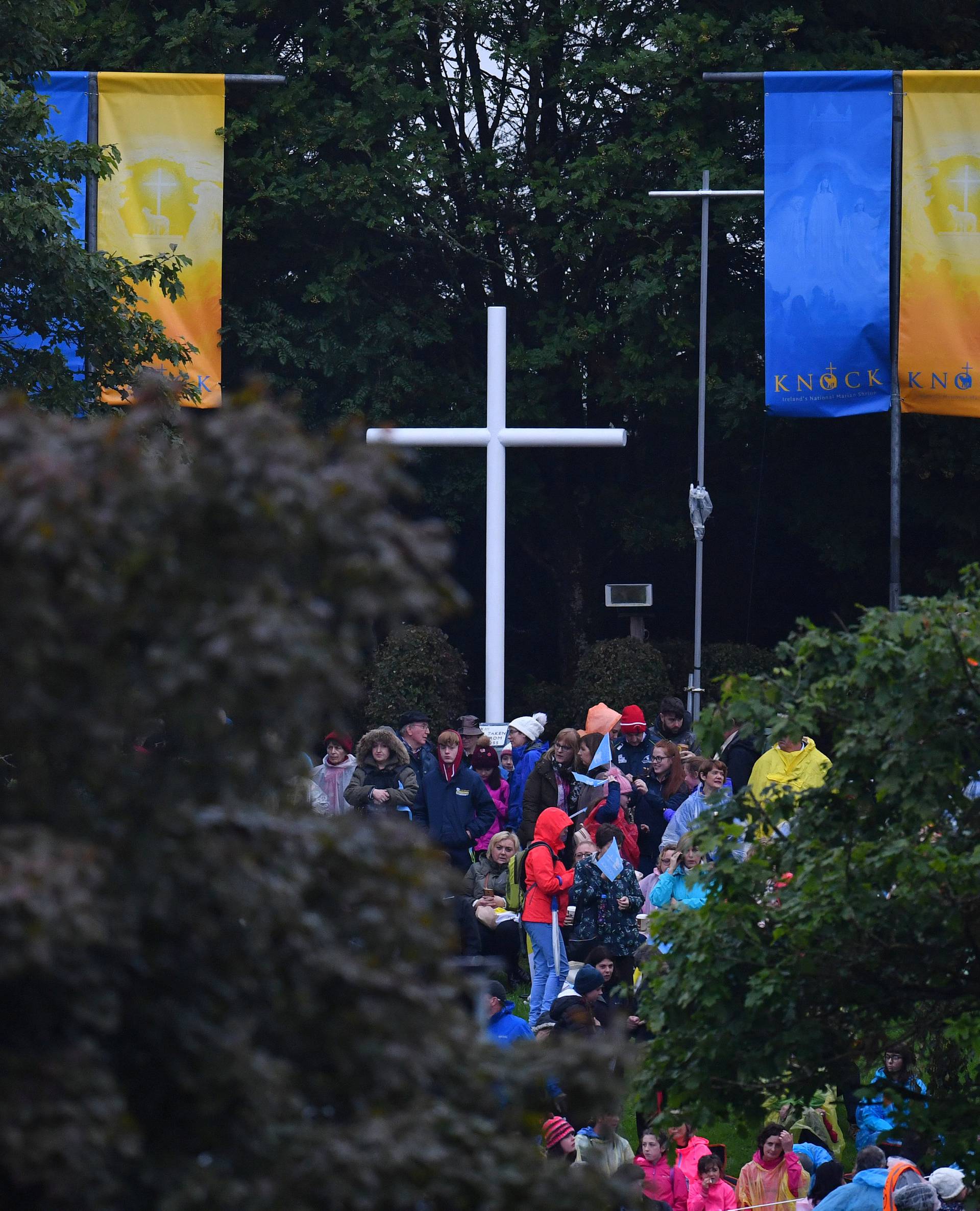 The faithful wait ahead of a visit of Pope Francis to Knock Shrine in Knock