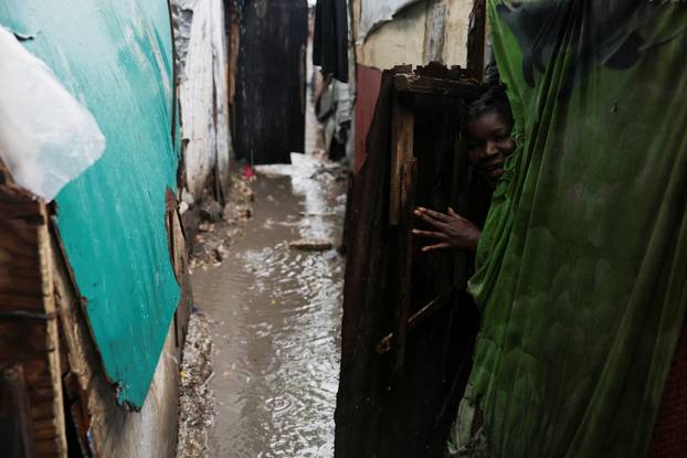 Haitians shelter from Hurricane Melissa's rains at church housing people displaced by gang violence, in Port-au-Prince