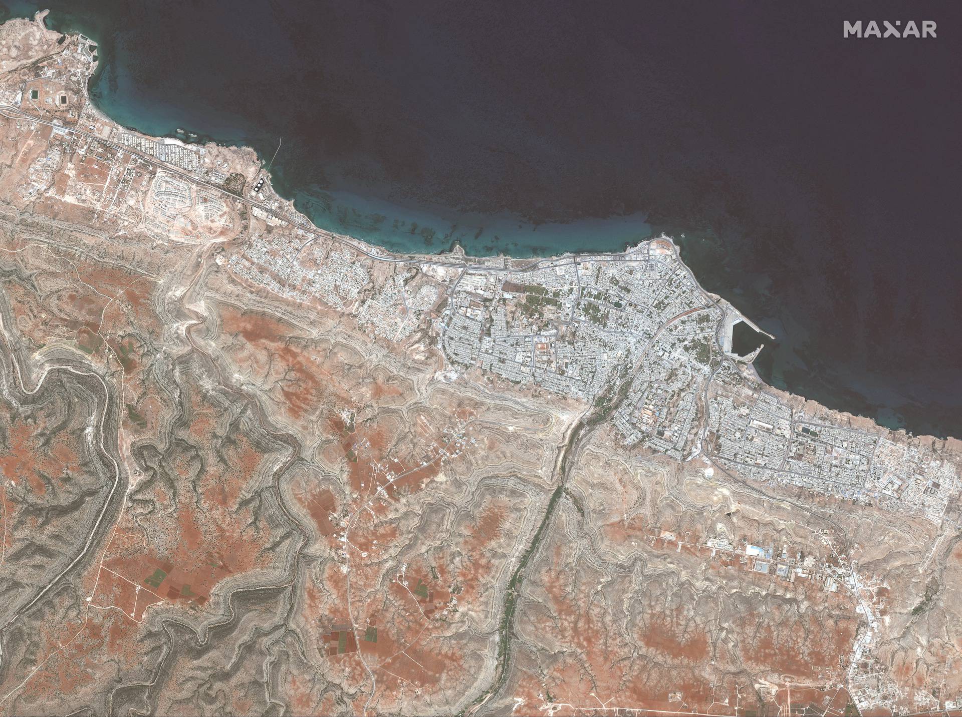 A satellite image shows the town of Derna before the floods